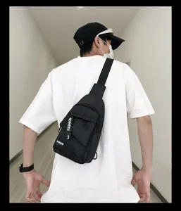 Detail of adjustable nylon strap and fashion logo on the black men's crossbody chest bag