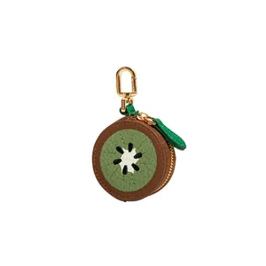 Mini porte-monnaie en forme de kiwi avec texture cuir vert et porte-clés doré