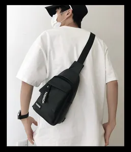 Detail of waterproof nylon chest bag featuring Fashion letter print and zipper pull
