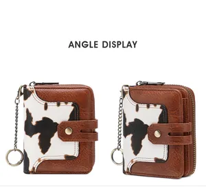 Close-up of RFID cow print wallet featuring vintage brown leather and bronze metal chain