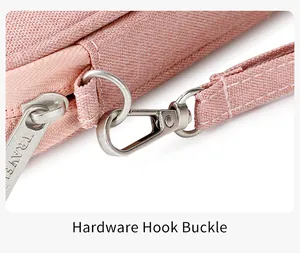Close-up of pink RFID passport bag with durable metal hook and TRAVEL engraved zipper
