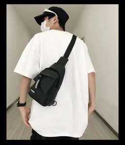 Detail of black nylon men shoulder bag featuring adjustable fashion branded strap