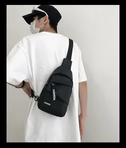 Close-up of durable black nylon chest bag with white fashion letter print and zipper