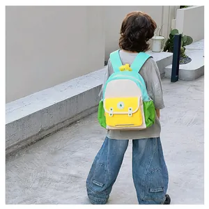Detail of colorful children's backpack with adjustable straps on young child outdoors