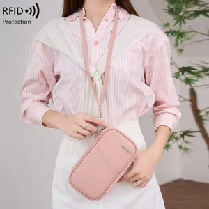 Pink RFID blocking travel passport neck pouch with adjustable strap and waterproof fabric