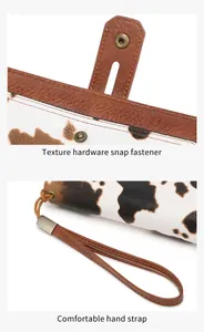 Details des Vintage-Druckknopfs und der Rindsleder-Textur auf dieser langen Geldbörse