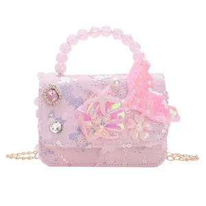 Borsa rosa con paillettes per bambine con manico di perle e tracolla a catena d'oro