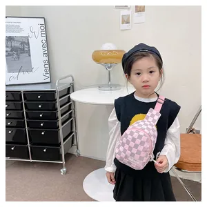 Detail of pink and white checkered kids crossbody bag with adjustable nylon strap