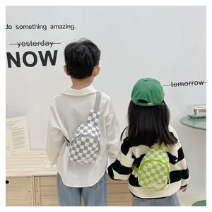 Kids quilted checkerboard crossbody bags with adjustable straps in grey and green