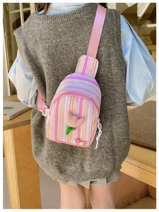 Detail of pink striped girl chest bag with 3D tulip flower and LOVE decor on a model