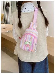 Detail of pink striped kids crossbody bag with grape applique and LOVE letter charm