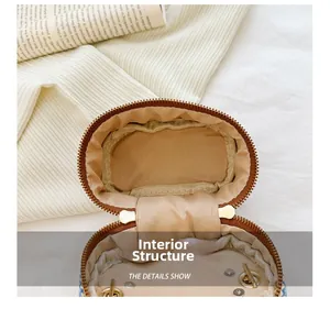 Internal structure of mini woven bag showing fine lining and secure metal snap fastener