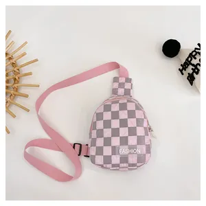Close-up of pink and grey checkerboard nylon kids chest bag with Fashion label
