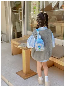 Rear view of a girl wearing a blue striped chest bag with a 3D tulip flower decoration