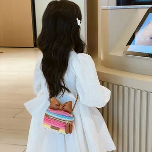 Rainbow woven chain crossbody bag for kids with brown faux leather bow and metal strap