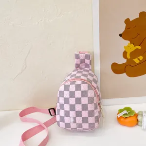 Detailed view of pink and gray checkered nylon kids chest bag with fashion label