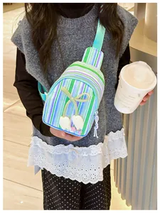 Detail of child's striped crossbody bag featuring a 3D tulip and adjustable strap