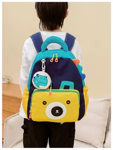 Detail showing the dinosaur fin and bear pattern on a kids backpack with soft padding