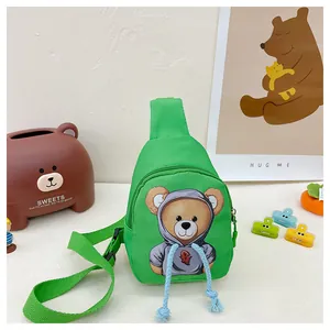 Green nylon kids chest bag featuring a cartoon bear print and adjustable straps