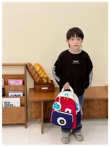 Detailed view of kids cartoon bear backpack with durable nylon fabric and side mesh pocket