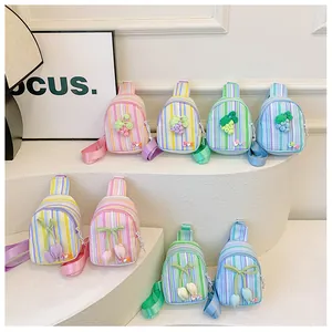 Detail of colorful striped mini chest bags for girls with tulip and grape decorations