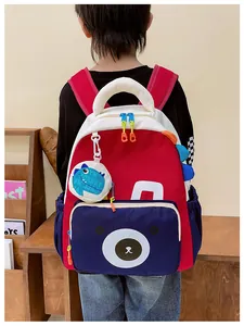 Detailed back view of children's dinosaur backpack with breathable mesh straps and bear pocket