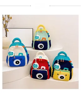 Multiple colorful dinosaur backpacks with cute bear faces and side mesh pockets