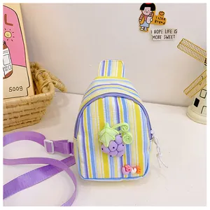 Detail view of children tulip chest bag with purple grape patch and adjustable strap