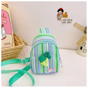 Detailed shot of kids canvas crossbody bag with striped pattern and grape charm decor