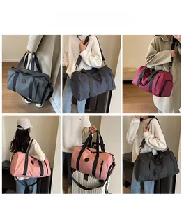 Macro shot of large travel bags in multiple colors with adjustable straps and side pockets