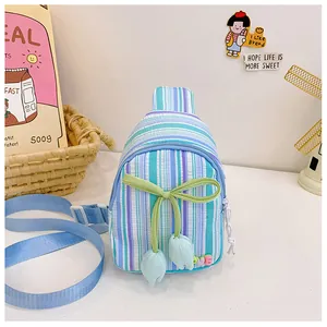 Close-up of a striped tulip cross-body bag for girls with bow and love patch details