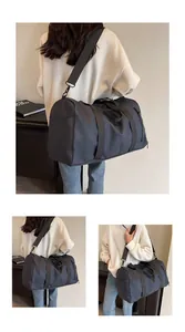 Detail of grey travel bag with durable straps and functional side zipper pocket