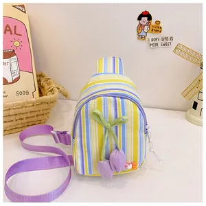 Detail of colorful striped crossbody bag with tulip charms and LOVE bead decorations