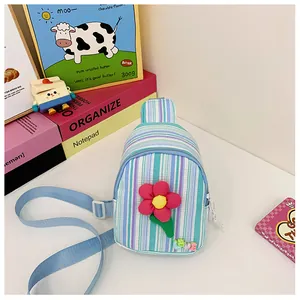 Detail view of striped kid's chest bag with a red flower applique and LOVE beads
