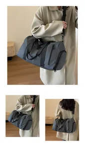 Detail view of large gray sports duffel bag with separate shoe compartment for travel