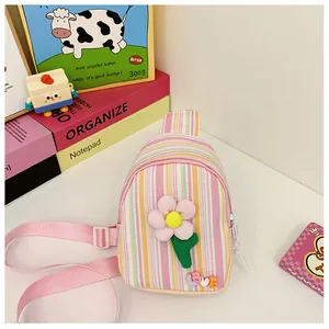 Detail of toddler chest bag with striped canvas, 3D floral petals, and LOVE letter decor