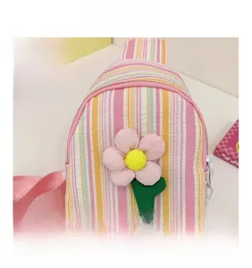 Close-up of pink striped canvas bag featuring decorative fabric flower and LOVE letters