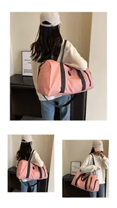 Pink large capacity travel bag with shoe compartment and detachable shoulder strap