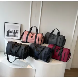 Detailed display of large travel bags in four colors with shoe compartment for fitness