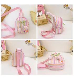 Detail showing the colorful striped kids bag with tulip decor and LOVE letter charm