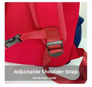 Detail of adjustable red shoulder straps with black buckles on kids dinosaur backpack