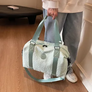 Mint green bubble textured large travel bag with detachable strap and top handle