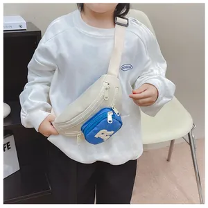 Detail of kids canvas crossbody bag featuring letter R embroidery and blue pocket zipper