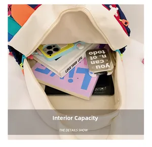 Interior capacity detail of nylon kids backpack showing books and large storage space