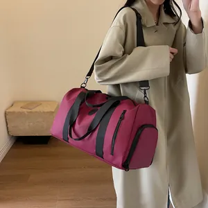 Detail of travel bag with independent shoe compartment and rose red waterproof nylon
