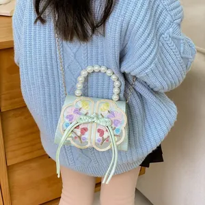 Floral embroidered girls handbag with pearl handle and golden chain strap for kids