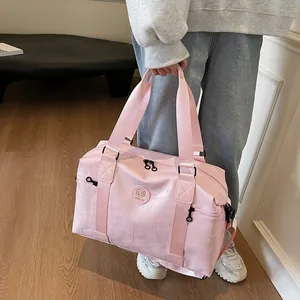 Rosa Reise-Handtasche mit geometrischer Prägung, großem Fassungsvermögen und JIA JIA Logo
