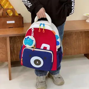 Kids dinosaur backpack with cute bear face and dinosaur tag for school activities