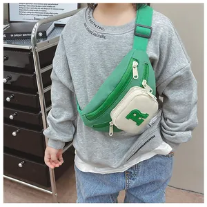 Kids sports crossbody bag with green color blocking and letter R embroidery detail