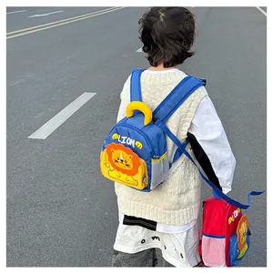 Detail of cute cartoon lion toddler backpacks in blue and red with mesh side pockets